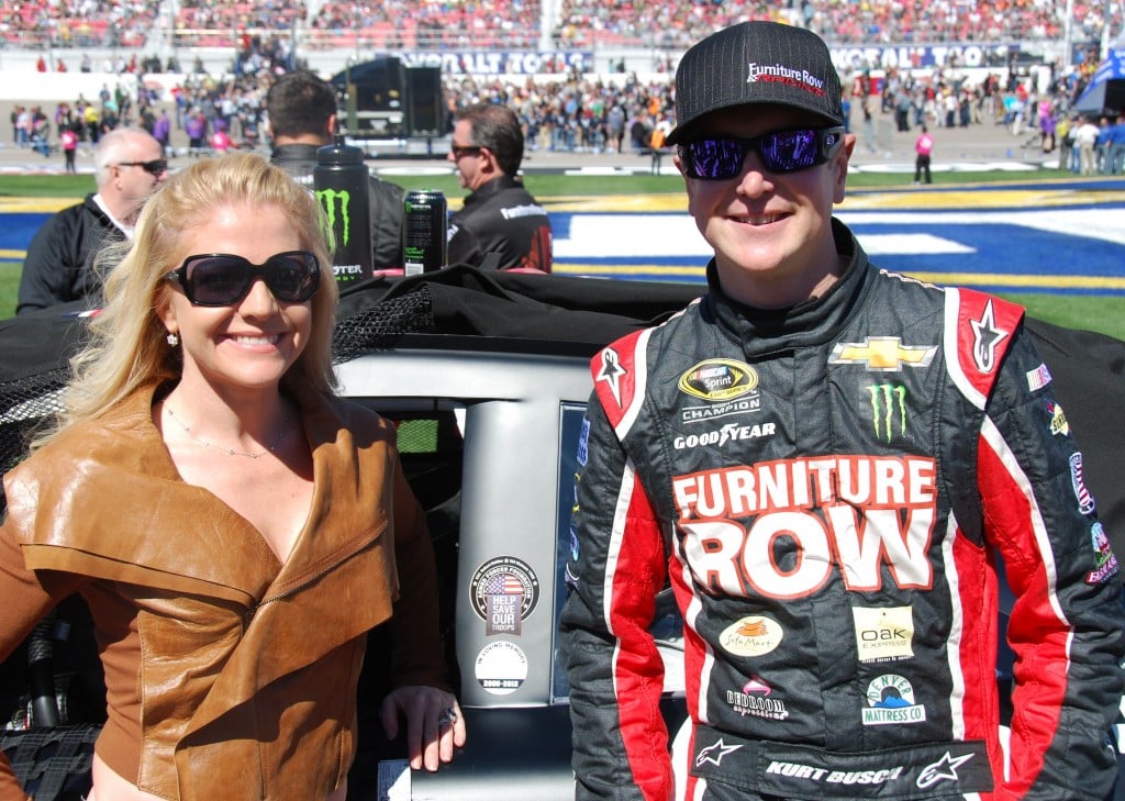 Pictured, from left, Armed Forces Foundation President Patricia Driscoll and NASCAR racer Kurt Busch display the logo honoring Columbia's Robert Holden before Sunday's race.  (submitted photo)