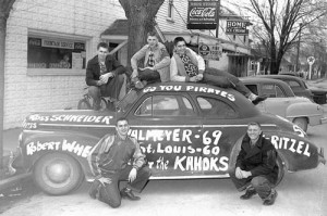 Pictured in front of Schneider’s Drugstore in old Valmeyer following a regional title win over East St. Louis are the starters from the 1952-53 VHS basketball team, kneeling in front, from left, Ross Schneider and Norb Vogel; on top of the car are Gene Mentel, Bob Wheat and Dennis Ritzel. (Republic-Times archive photo by Bob Voris)