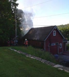 Firefighters work at the scene of a Saturday morning fire in Maeystown. (Kermit Constantine photo)