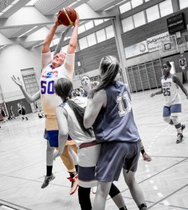 Valmeyer's Emmi Stuart pulls down a rebound while playing for the USA East team during the recent United World Games. (photo courtesy Jerry Stuart, Big Stu Films)