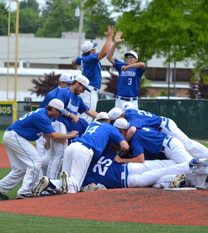 Freeburg players celebrate following a 9-6 win in the sectional title game over Waterloo. (Corey Saathoff photo)