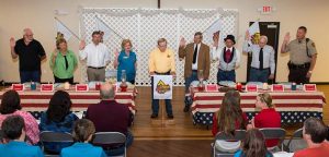 Pictured, county officer participate in a ceremonial reenactment of the first county board meeting Saturday at St. Mary's Parish Center in Valmeyer as part of the Monroe County Bicentennial. They are, from left, assessor Carl Wuertz, coroner Vicki Koerber, treasurer Kevin Koenigstein, circuit clerk Sandy Sauget, county clerk and Bicentennial co-chairman Dennis Knobloch, commissioners Terry Liefer, Delbert Wittenauer and Bob Elmore, and sheriff Neal Rohlfing. (Alan Dooley photo)