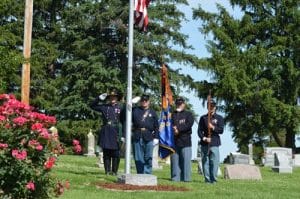 Members of the Friedrich K. Hecker Camp 443 Sons of Union Veterans of the Civil War stand guard during the playing of our National Anthem at St. Augustine Cemetery in Hecker.