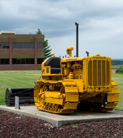 Luhr Brothers’ first heavy equipment, a small Caterpillar D8 bulldozer, is preserved on the front lawn of the Columbia firm, which was founded in 1939. (Alan Dooley photo)