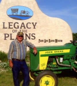 Pictured, from left, John Meier and Kenny Wild traveled through Nebraska on a restored John Deere Model 520 tractor, which they transported to Nebraska on a hand-built trailer. (submitted photo)