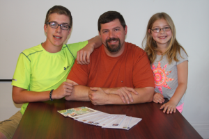 J.R. Wallace takes time off of work Wednesdays to be with his son Donovan, 12, and his daughter Julia, 8. Wallace received many letters of appreciation from students whose classes he spoke to about his experiences. (Sean McGowan photo)