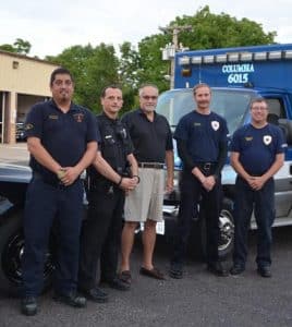 Pictured with heart attack survivor Dave Altvater (center), from left, are Anthony Perez of Columbia EMS, Columbia police officer Ryan Doetsch, and Brandon Layton and Tim May of Columbia EMS. (Corey Saathoff photo)