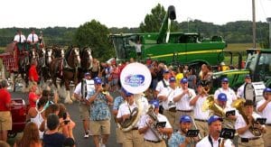 Pictured, the Bud Light Brigade leads the Budweiser Clydesdale hitch in a parade around the fairgrounds Thursday night, beginning with a rousing rendition of “Here Comes the King.” (Kermit Constantine photo)