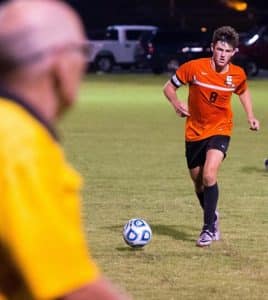 Waterloo's Ben Huels pushes the ball forward during a recent game. (Alan Dooley photo)