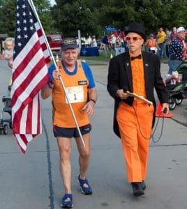 Pictured is retired U.S. Navy submariner Sid Busch with Hills and Hollows race organizer Marvin Fisher during Saturday's event in Valmeyer. (Alan Dooley photo)