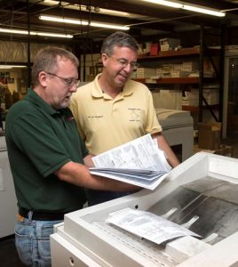 Pictured are the 2016 Monroe County property tax bills being printed at MAR Graphics in Valmeyer. Tax bills are expected to be mailed out later this week. (Alan Dooley photo)