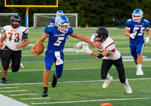 Columbia quarterback Greg Long eludes Waterloo defenders during a scramble near the endzone on Friday night. Long is this week's R-T Athlete of the Week for his performance last Friday. For more photos from the game, click here. (Alan Dooley photo)