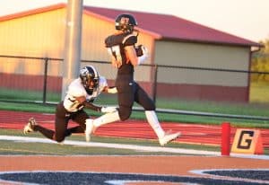 Senior wide receiver Kyle Knefelkamp evades a Carbondale defender to find the end zone.