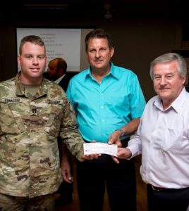 U.S. Army Capt. Dan Strasser, representing the Army Corps of Engineers, was presented a check for $62,000 by Prairie du Rocher Levee District President Steven Gonzalez and Prairie du Rocher Village President Raymond Cole during a meeting to discuss the levee process on Wednesday. The money will be used to pay the Corps to complete a survey of the levee that will hopefully lead to its certification.  (Alan Dooley photo)