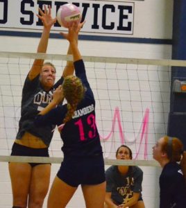 Waterloo's Kat Finnerty goes up to block an attempt by Gibault's Lexi Chambers during Thursday's match.