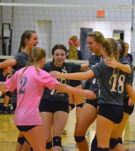 Waterloo volleyball players celebrate a point during Thursday's "Volley For a Cure" showdown at Gibault. For more photos, visit www.republictimes.net/photo-store.(Corey Saathoff photos)