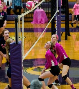Pictured, the volleyball settles briefly on top of the net during last Monday's "Volley For the Cure" match between Gibault and Valmeyer. (Alan Dooley photo)