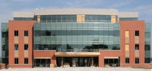 Pictured is the front of 11 South, a new medical office building off Sand Bank Road. Workers put the finishing touches on concrete work and are installing windows so drywall can begin to go up inside the building. (Andrea Saathoff photo)