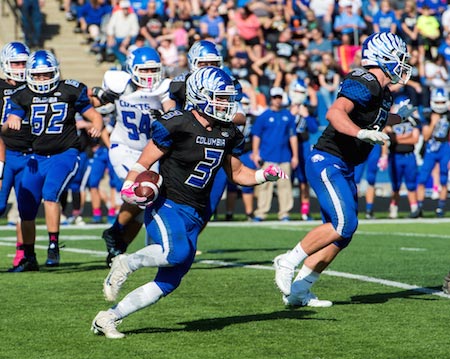 Columbia's Colton Byrd follows the lead block of offensive lineman Owen Suedkamp for a positive gain Saturday at home against Greenville. (Alan Dooley photo)