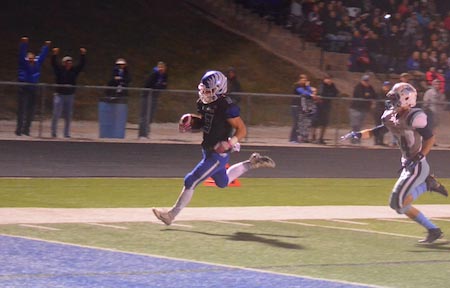 Columbia running back Colton Byrd scores on a 49-yard run in the first quarter of Friday's game. (Corey Saathoff photo)