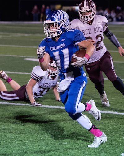 Jared Germain runs for extra yardage following a reception in the first half of Friday's game. (Alan Dooley photo)