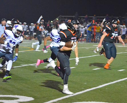 Waterloo running back Scott Nanney turns on the jets for a 45-yard touchdown run to start the fourth quarter on Friday night. (Corey Saathoff photo)