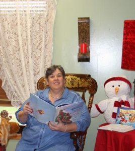 Jan Dudley shows off the room where Mrs. Claus will read to the children during the Christmas Walk. (Sean McGowan photo)