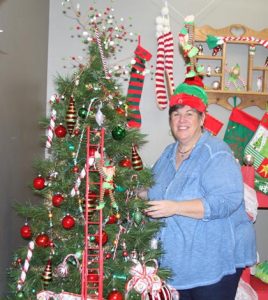 Jan Dudley proudly displays the Elf Land area that kids will see at this year’s Christmas Tree Walk. (Sean McGowan photo)