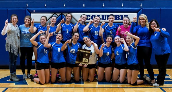 The Columbia High School volleyball team celebrates its regional championship win at home against Waterloo last month. (Alan Dooley photo)