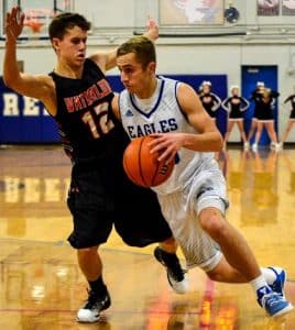 Pictured, Columbia's Jordan Holmes drives against Waterloo's Griffin Lenhardt during Monday's rivalry contest at the Freeburg tournament. (John Spytek photo)