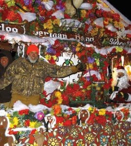 Pictured, from left, are Santa’s helpers Jim Probst and Steve Frank, George Obernagel as Santa, and Jodie Probst. Not pictured, but also braving the Sunday night cold, Brad Nobbe and Terry Liefer stand on the opposite side of the float. (Kermit Constantine photo)