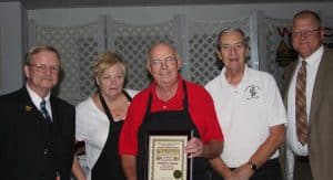 Bicentennial committee co-chairs Dennis Knobloch (left) and Mike Kovarik (right) present Turner Hall facilities manager Bonnie Straub, Turner Hall president Ken Schmidt and Turner Hall treasurer-secretary Glen Stechmesser a plaque commemorating the Columbia Gymnastics Association’s 150th anniversary during the recent gala.