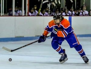 Freeburg-Waterloo's Adam Phelps skates toward the puck during last week's game against Triad.