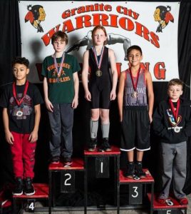 Pictured at center is MC Bulldogs wrestler Avery Smith, who won first place in the ages 9-10 division at the Granite City Steel National Tournament on Dec. 30. (submitted photo)