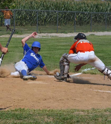 Columbia's Patrick Davis slides home safely during game one of Sunday's doubleheader against the St. Louis Printers at Kleinschmidt Field on Sunday. (Corey Saathoff photo)