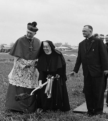 The Gibault Catholic High School groundbreaking took place  in April 1966 at the current school grounds. Pictured, from left, after Most Rev. Albert R. Zuroweste, bishop of the Belleville Diocese, blessed the ground, he and Sister Angelita Myerscough break ground while Monsignor Elmer Holtgrave watches and Father Ed Hustedde looks on. (Republican archive photo)
