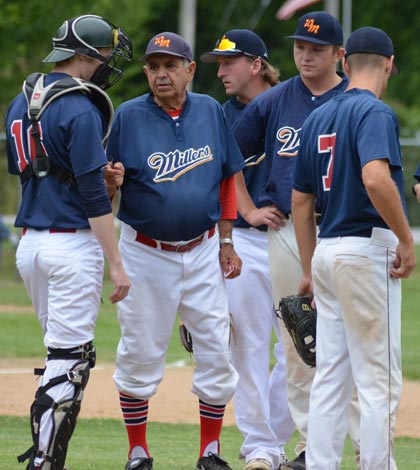 Waterloo Millers manager Vern Moehrs holds a meeting on the mound with his players during a recent game. For more photos from the Mon-Clair League season, visit www.republictimes.net/photo-store. (Corey Saathoff photo)