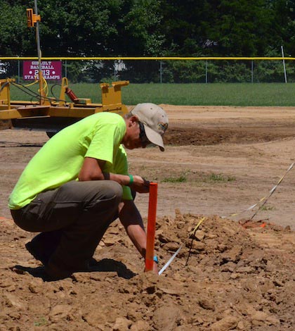 An employee from MJM Services of Belleville perform work on the recently bulldozed infield area of SPPS Field in Waterloo on Tuesday. (Corey Saathoff photo)