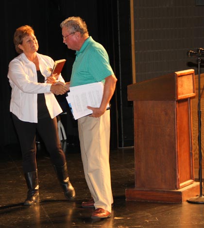 Monroe County Board candidates Vicki Koerber and Leo Stephan shake hands following their debate Thursday night.