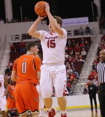 Columbia High School graduate Jonny Holmes shoots the ball for the University of Arkansas during a recent game. (submitted photo)