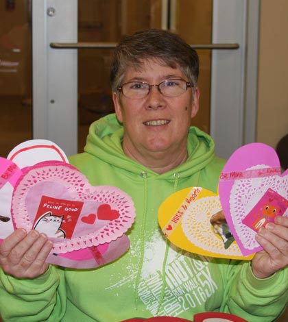 Brenda Lanman displays the various hearts she crafted as part of the “Buy a Heart, Save a Heart” fundraising campaign for Helping Strays. (Sean McGowan photo)