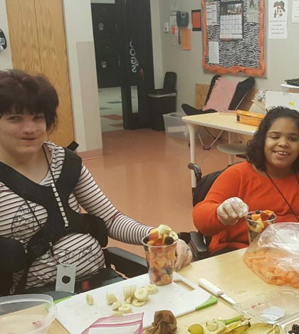 Pictured, from left, Sarah Amann and Arreona Ray prepare the fruit cups for the teachers breakfast. (submitted photos)