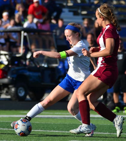 Pictured, Columbia's Blair Wittenbrink works the ball against a Gibault defender during the regional title game on Friday night. For more photos from the game, visit www.republictimes.net/photo-store. (John Spytek photo)