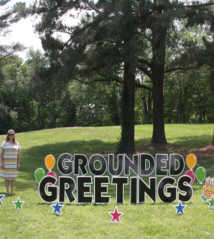 Pictured, Grounded Greetings owner Amy Strong displays a sample yard greeting. (Sean McGowan photo)