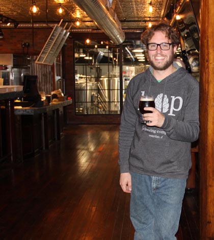 Pictured, Hopskeller Brewmaster Matt Schweizer stands at the entryway to his upgraded kitchen where a fire last fall had caused the ceiling to give way. (Sean McGowan photo)