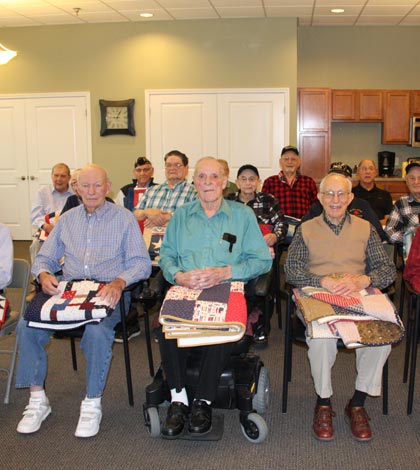 Pictured are the veterans at Legacy Place in Waterloo who were honored during Saturday’s Quilts of Valor ceremony. (Sean McGowan photo)