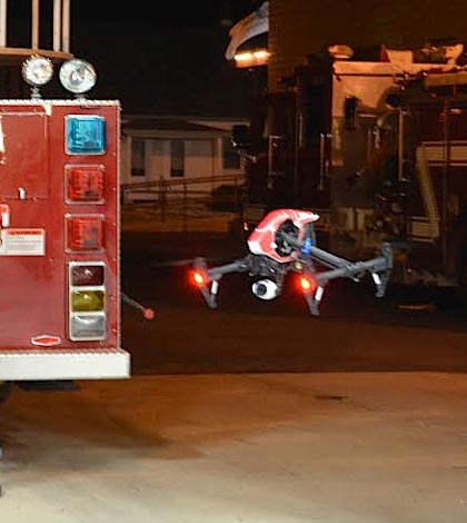 Pictured, Brad Roessler (left) flies the Columbia Fire Department drone at the firehouse via remote control as Steve Doyle looks on. (Andrea Saathoff photo)