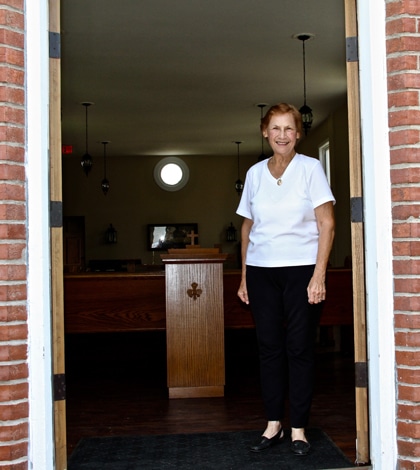 Pictured, Alberta Spradling stands inside the historic Columbia church she has helped renovate. 
(Kermit Constantine photo)