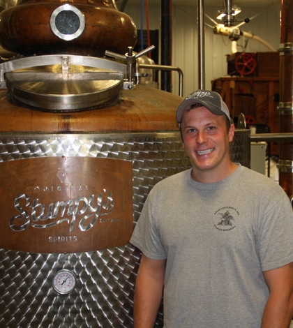 Pictured, Stumpy’s Spirits Distillery owner Adam Stumpf stands next to his distillation equipment. The distillery has been open for three years in rural Columbia. 
(James “Tal” Moss photo)