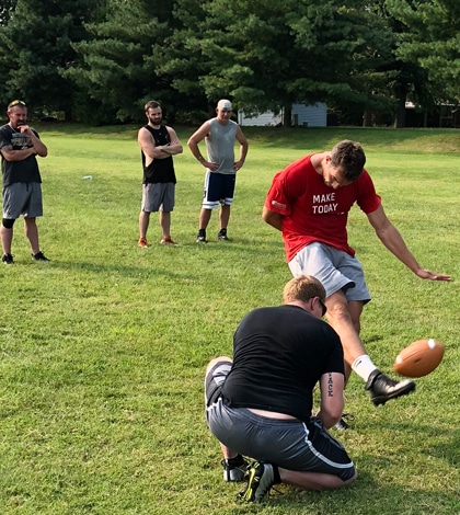 Pictured, 2013 Waterloo High School graduate Clayton Bourgeois kicks while 2007 WHS grad Blake Novack holds during a recent practice. (submitted photo)